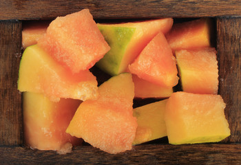 slices of pawpaw in wooden box