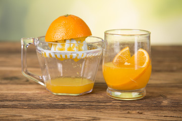 Natural orange juice, squeezer, oranges