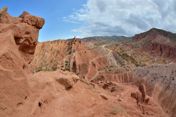 Colourful Skazka canyon rock formations,made by water and wind, located on the shore of Issyk-Kul lake,Kyrgyzstan,Central Asia