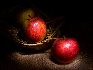 Fresh red apples on rustic background