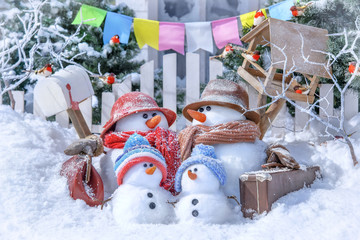 Postcard with Christmas and a new year with  cute snowmen