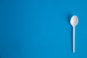 plastic spoon on colorful background