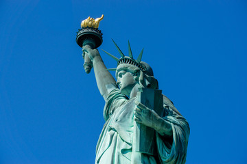 Statue of Liberty front close up on a blue sky background New York City