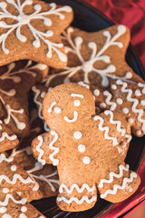 close up of traditional christmas cookies and gingerbread man with icing