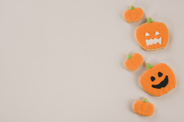 Fresh delicious homemade decorated halloween cookies sweets on dark wooden background, concept of halloween party, copy space(text space), top view, blank for text.