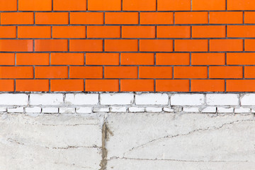 Wall of red brick and foundation as background