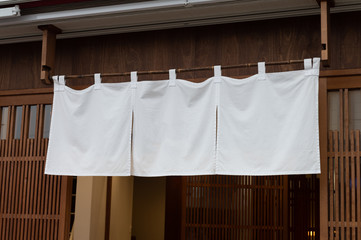 The curtain-like fabric that hangs in front of traditional Japanese restaurants and shops not only serves as a signboard, but holds a larger meaning,