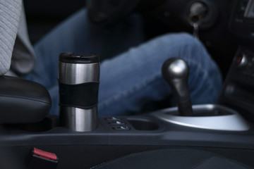 Thermo mug in the Cup holder in the car