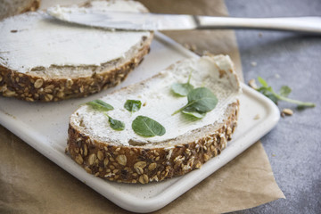 Whole Grain Sandwiches with Soft Cream Cheese and Greens