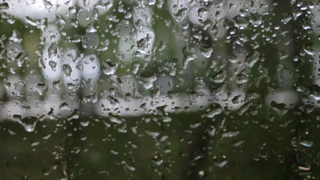 rainy day scene, water drops on glass window