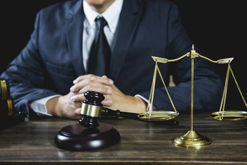 Legal law, Judge gavel with Justice lawyers advice with gavel and Scales of justice, Counselor or Male lawyer working on courtroom sitting at the table and papers