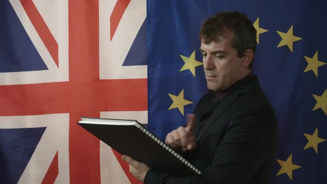 Middle Aged Trade Negotiator Reads Documentation and Shows Negative Gesture Side View