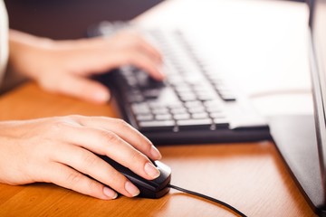 Close-Up of Woman hands Using Mouse and Keyboard