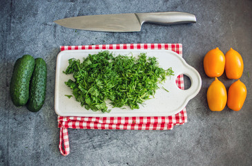 Fresh chopped greens on a  board
