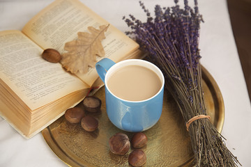 cozy reading of your favorite book in the autumn morning with a Cup of coffee, enjoying the smell of dried lavender