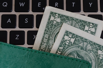 Dollar Banknotes On A black Keyboard
