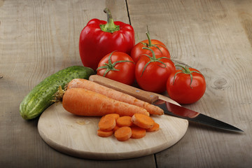 heap of vegetables on wooden background