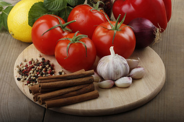 vegetables and spices on wooden background