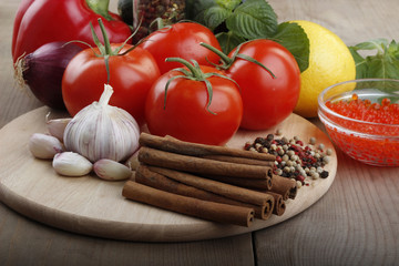 vegetables and spices on wooden background