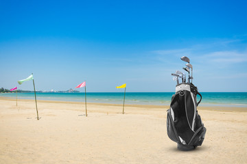 Golf bag and Golf club sea and blue sky as background . Business, Health with relaxation concepts