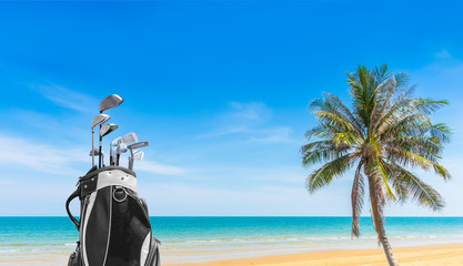 Golf bag and Golf club sea and blue sky as background . Business, Health with relaxation concepts