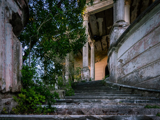 Fototapeta na wymiar Stairs to the past in an abandoned building