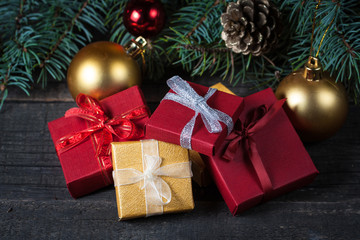 Luxury New Year gifts, different present boxes under Christmas tree in holiday eve, Christmastime celebration, home decorated with festive shiny balls, magic night