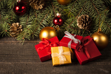 Luxury New Year gifts, different present boxes under Christmas tree in holiday eve, Christmastime celebration, home decorated with festive shiny balls, magic night