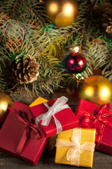 Luxury New Year gifts, different present boxes under Christmas tree in holiday eve, Christmastime celebration, home decorated with festive shiny balls, magic night