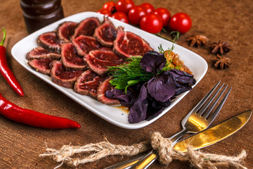 Meat steak beef with fresh vegetables, herbs on white dish