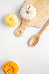 Pumpkins on the wooden board