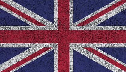Fototapeta premium Flag of the United Kingdom drawn with paint on road asphalt