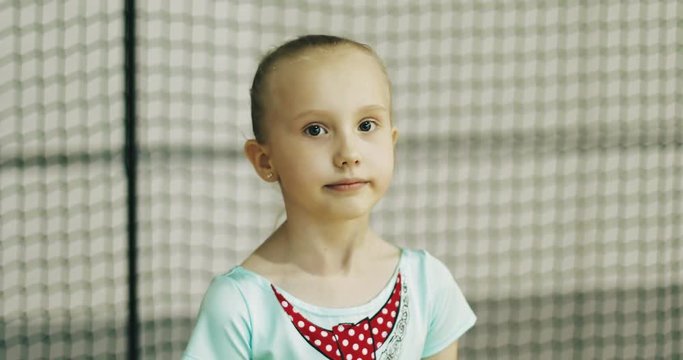 Portrait of a small modest girl gymnast.