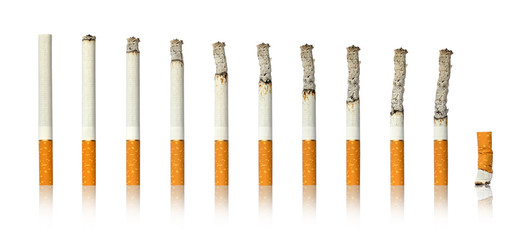 Cigarettes burning cigarette butt on white isolated background.