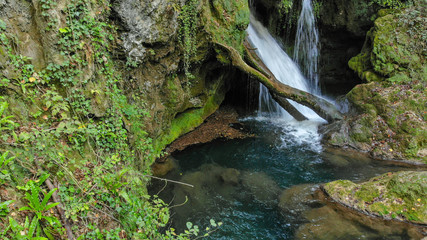 Naklejka na ściany i meble Waterfall Cascada at Vaioaga in national park Cheile Nerei Beusnita - Romania