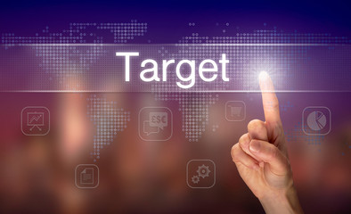 Obraz premium A hand selecting a Target business concept on a clear screen with a colorful blurred background.