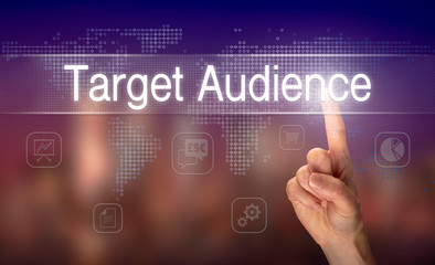 A hand selecting a Target Audience business concept on a clear screen with a colorful blurred background.