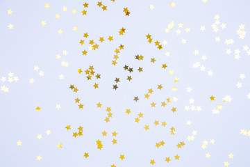 Star shaped sprinkles on blue background. Holiday, party and celebration concept