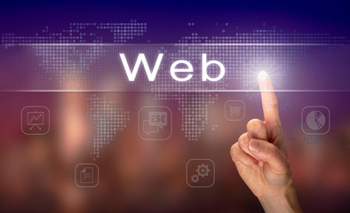 A hand selecting a Web business concept on a clear screen with a colorful blurred background.