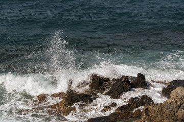 waves crashing on rocks