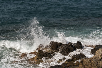 waves crashing on rocks