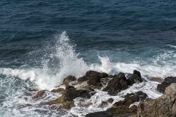 waves crashing on rocks