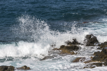 waves crashing on rocks