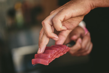 Crop chef serving tuna fish