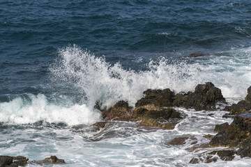 waves crashing on rocks