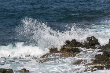 waves crashing on rocks