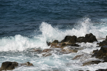 waves crashing on rocks
