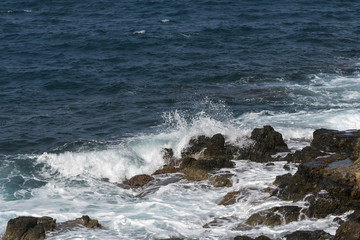 waves crashing on rocks