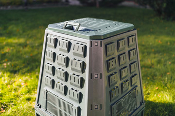 compost bin on green grass background