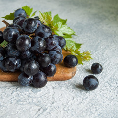 ripe grapes on wooden table